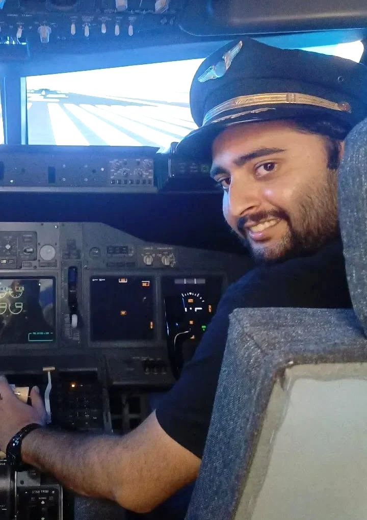 A closer view of Aditya Sarin at the flight simulator controls