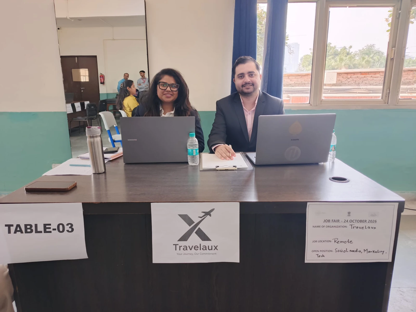 Aditya Sarin and a colleague at the Travelaux recruitment desk at the 24 October 2026 job fair